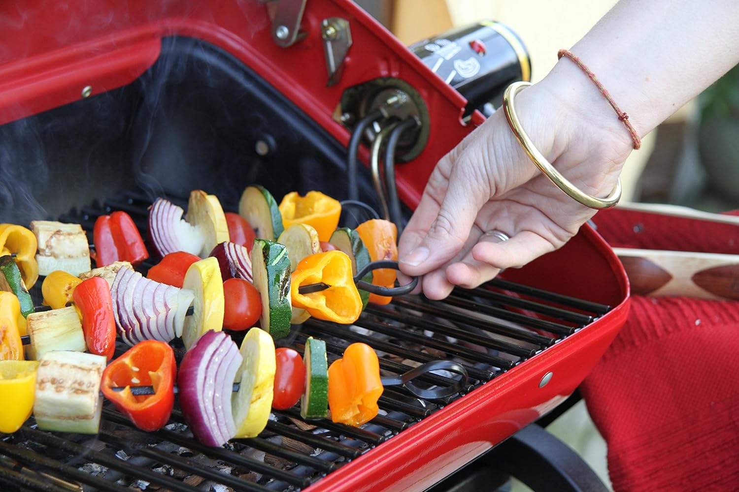 Americana Electric Cart Grill with two polymer side tables, wire shelf and rotisserie