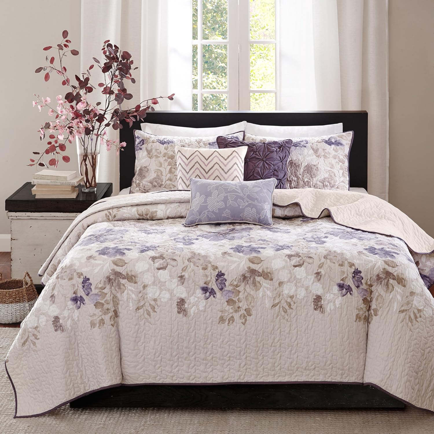 Material color is pure white and the quilt is soft and lays smoothly on the bed.