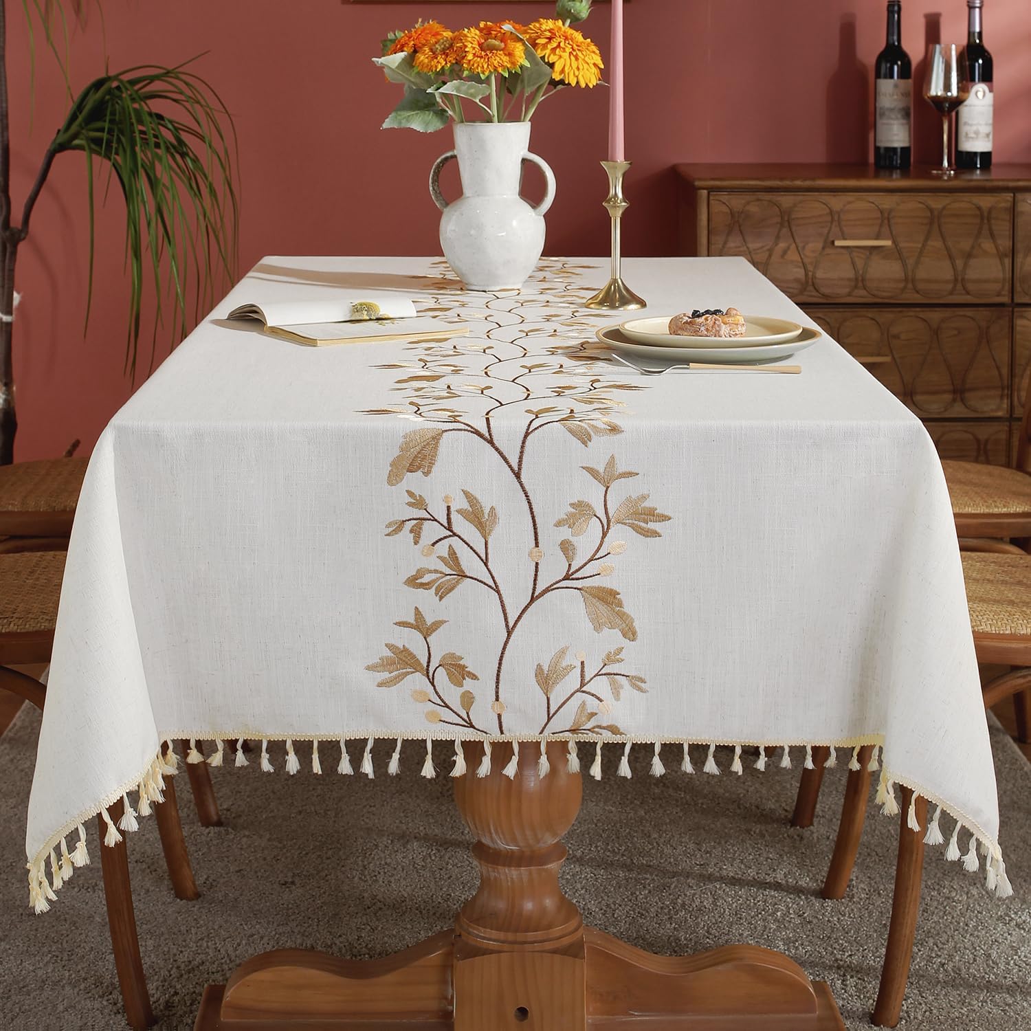 This table cloth is excellent in beauty, fit and quality! The soft green leaf pattern is offset by a light brown accent. It is not a stamped on print, but a lovely embroidered pattern which is rare on today' table cloth! It rivals an elegant, expensive European cloth in quality and beauty! It is square, however still fit my oval Table! I highly recommend this product. HR