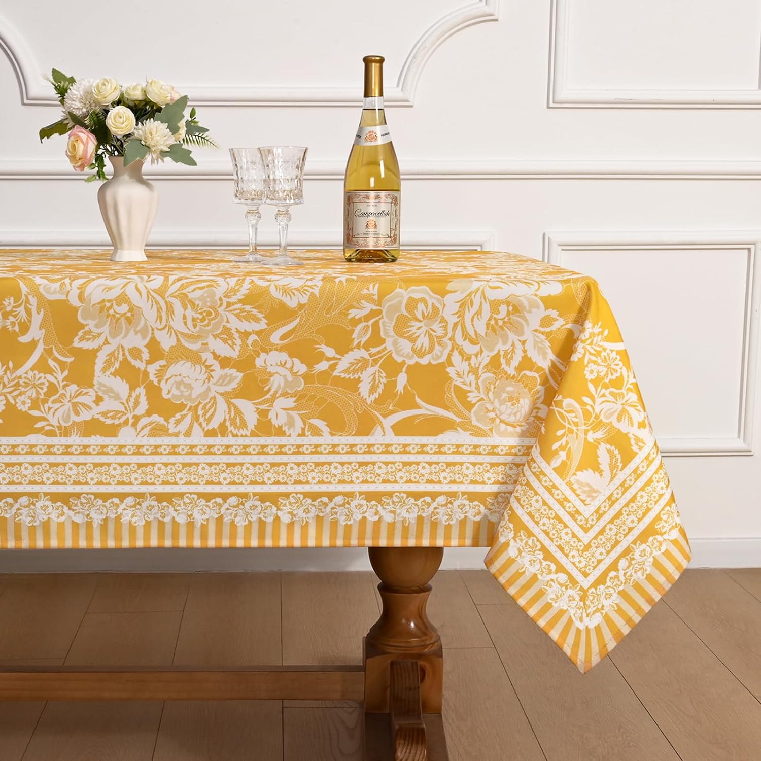 This tablecloth looks just like the product pictures and is very pretty. I like the color and pattern. The fabric is thick and feels durable, and also water resistant. The fabric feels like a cross between linen and the plasticky outdoor table clothes, so it has the benefit of being resistant to spills but feels nicer to the touch. I don't think it feels as nice as true linen, but true linen isn't water resistant, so this is a good compromise solution. Overall, I think this is a good table cloth